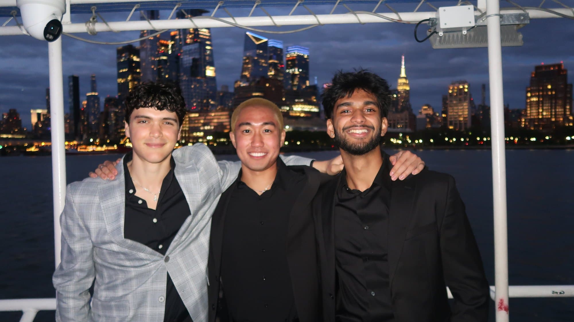 Three brothers on the Hudson at the boat formal